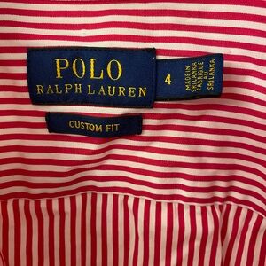 Selection of women’s polo dress shirts. Multiple colors.